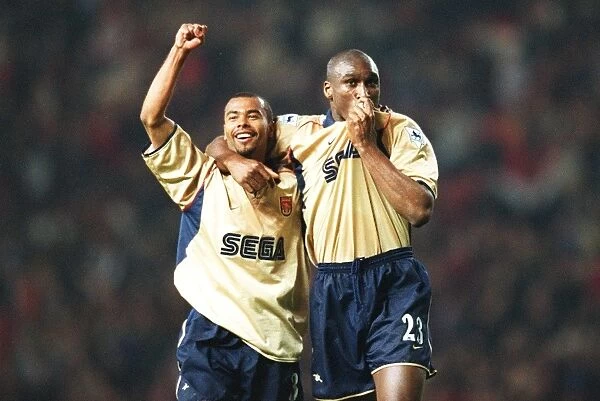 Glory Days: Sol Campbell and Ashley Cole Celebrate Arsenal's Championship Win at Old Trafford, 2002