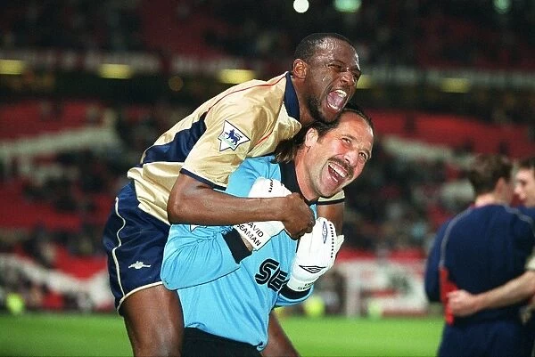 Glory Days: Vieira and Seaman Celebrate Arsenal's Championship Win at Old Trafford, 2002