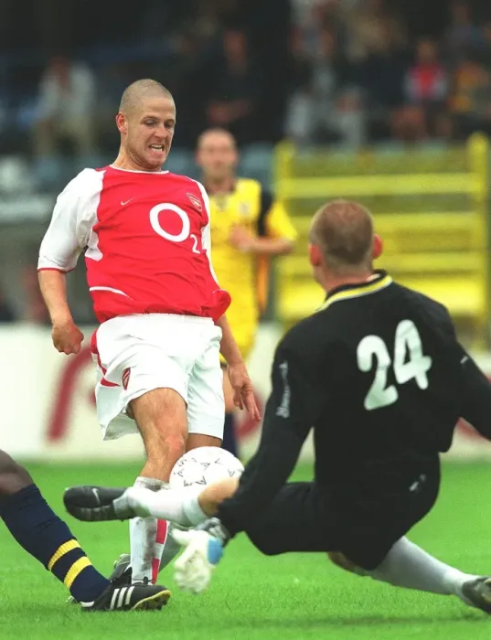 Framed Print : Graham Barrett shoots past Beveren goalkeeper Graham Stack to score the Arsenal goal Framed Print : Graham Barrett shoots past Beveren goalkeeper Graham Stack to score the Arsenal goal