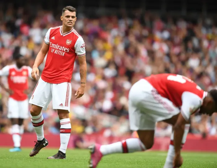 Framed Print : Granit Xhaka in Action: Arsenal vs. Olympique Lyonnais - Emirates Cup 2019