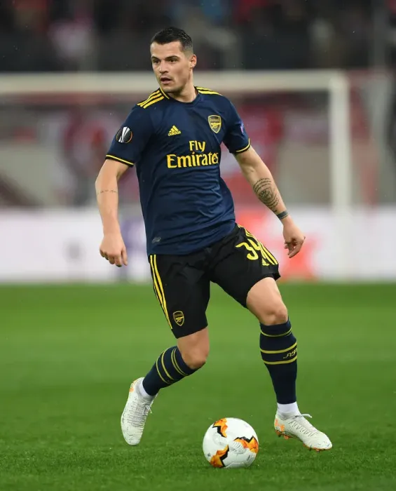 Framed Print : Granit Xhaka in Action: Arsenal vs. Olympiacos, UEFA Europa League Round of 32 (Piraeus, 2020) Framed Print : Granit Xhaka in Action: Arsenal vs. Olympiacos, UEFA Europa League Round of 32 (Piraeus, 2020)