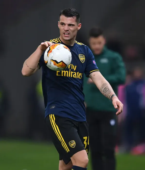Framed Print : Granit Xhaka in Action: Arsenal vs. Olympiacos, Europa League Round of 32 (2020)