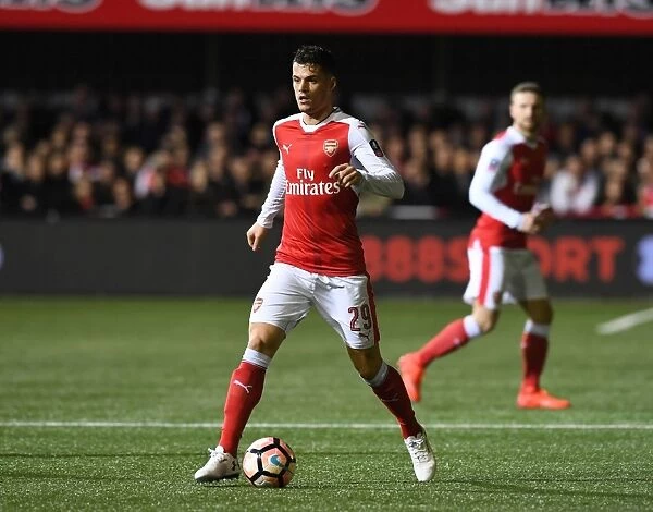 Granit Xhaka in Action: Arsenal's FA Cup Fifth Round Battle at Sutton United