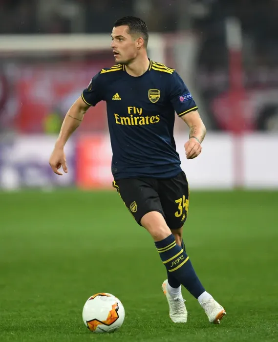 Framed Print : Granit Xhaka in Action: Olympiacos vs. Arsenal, UEFA Europa League Round of 32 (Piraeus, 2020)