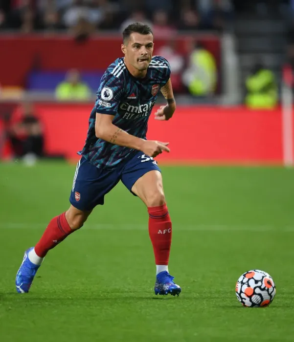 Framed Print : Granit Xhaka: Arsenal's Midfield Maestro in Action against Brentford, 2021-22 Premier League Framed Print : Granit Xhaka: Arsenal's Midfield Maestro in Action against Brentford, 2021-22 Premier League