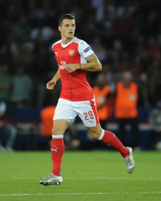 Framed Print : Granit Xhaka: Arsenal's Midfield Maestro in Action against Paris Saint-Germain, UEFA Champions League 2016-17 Framed Print : Granit Xhaka: Arsenal's Midfield Maestro in Action against Paris Saint-Germain, UEFA Champions League 2016-17
