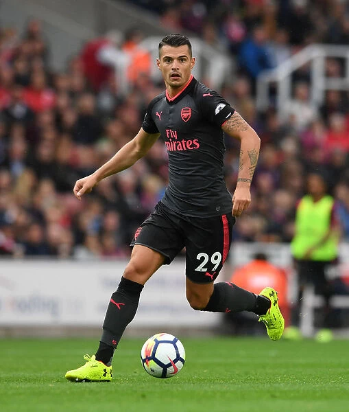 Granit Xhaka: Arsenal's Midfield Mastermind in Action against Stoke City, Premier League 2017-18