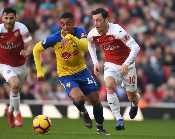 Framed Print : Granit Xhaka Breaks Past Southampton's Yan Valery in Arsenal's Premier League Clash