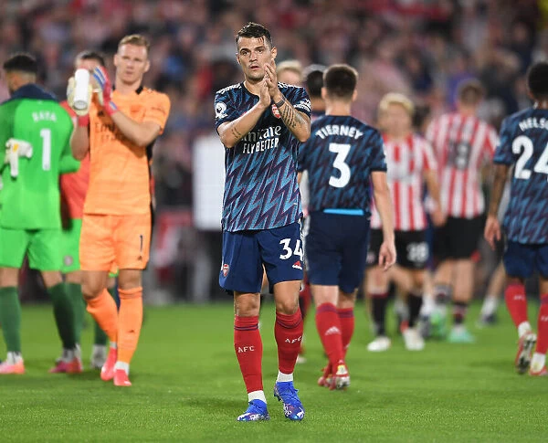 Granit Xhaka Celebrates with Arsenal Fans after Brentford Victory - Premier League 2021-22