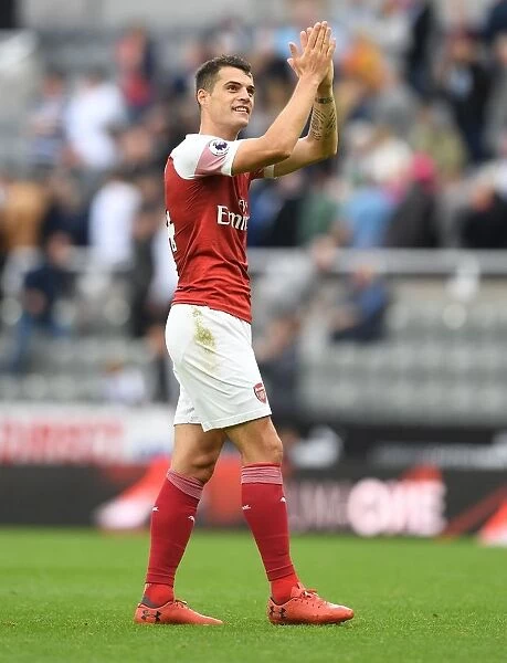 Granit Xhaka Celebrates with Arsenal Fans after Newcastle United Victory