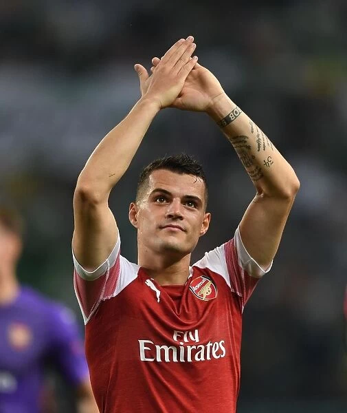 Granit Xhaka Celebrates with Arsenal Fans after UEFA Europa League Win over Sporting Lisbon