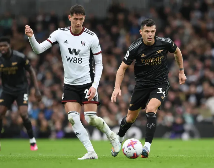 Framed Print : Granit Xhaka Closes Down Sasa Lukic: Intense Moment from Fulham vs. Arsenal Premier League Clash (2022-23)