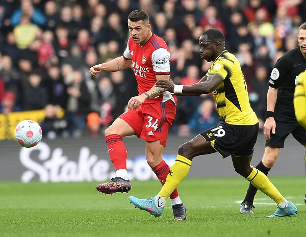 Granit Xhaka Faces Pressure from Moussa Sissoko in Watford vs Arsenal Premier League Clash