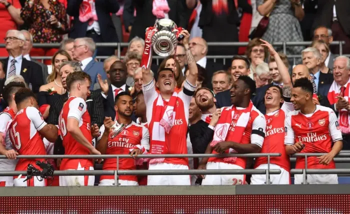 Framed Print : Granit Xhaka Lifts FA Cup Trophy: Arsenal's Victory over Chelsea (2017)