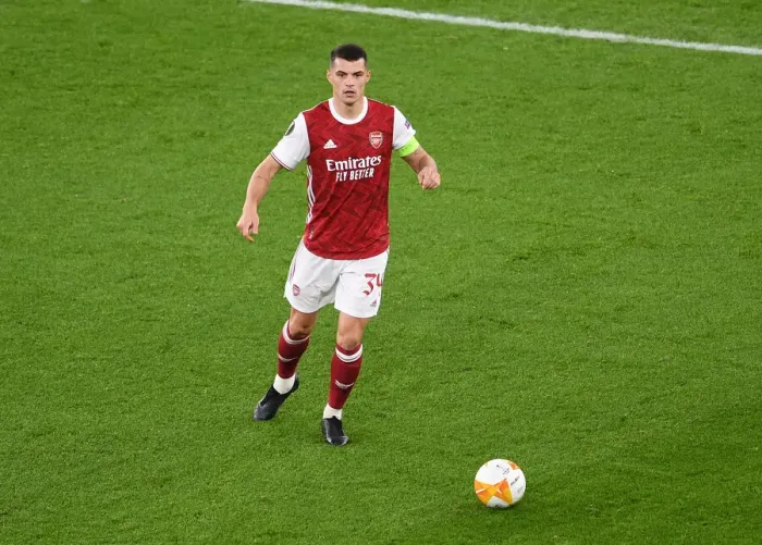 Framed Print : Granit Xhaka Plays Alone: Arsenal's Empty Emirates Stadium in UEFA Europa League Match against Dundalk