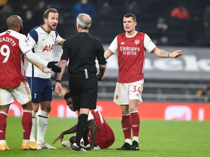 Framed Print : Granit Xhaka Protests Referee Decision During Tottenham vs. Arsenal Premier League Clash (2020-21) Framed Print : Granit Xhaka Protests Referee Decision During Tottenham vs. Arsenal Premier League Clash (2020-21)