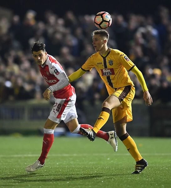 Granit Xhaka vs. Adam May: A FA Cup Battle at Sutton United