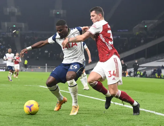 Framed Print : Granit Xhaka vs. Serge Aurier: Clash of the London Rivals in the Premier League