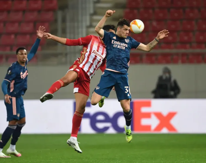 Framed Print : Granit Xhaka vs Youssef El Arabi: Olympiacos vs Arsenal in Empty Karaiskakis Stadium, UEFA Europa League Round of 16 Framed Print : Granit Xhaka vs Youssef El Arabi: Olympiacos vs Arsenal in Empty Karaiskakis Stadium, UEFA Europa League Round of 16