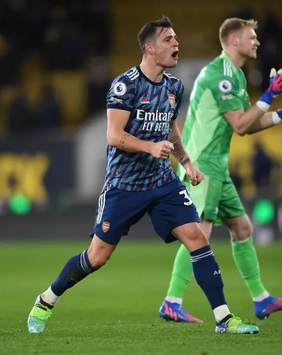 Framed Print : Granit Xhaka's Euphoric Celebration: Arsenal's Triumph at Wolverhampton Wanderers, Premier League 2021-22