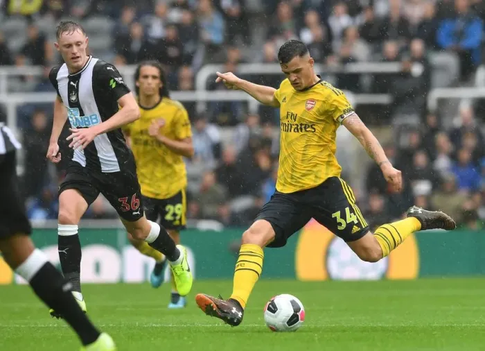 Framed Print : Granit Xhaka's Midfield Masterclass: Arsenal's Win Against Newcastle United
