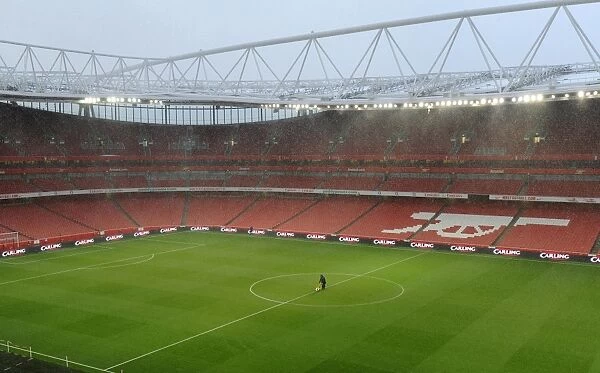 The Groundsman marks out the pitch before the match. Arsenal 2: 0 Wigan Athletic