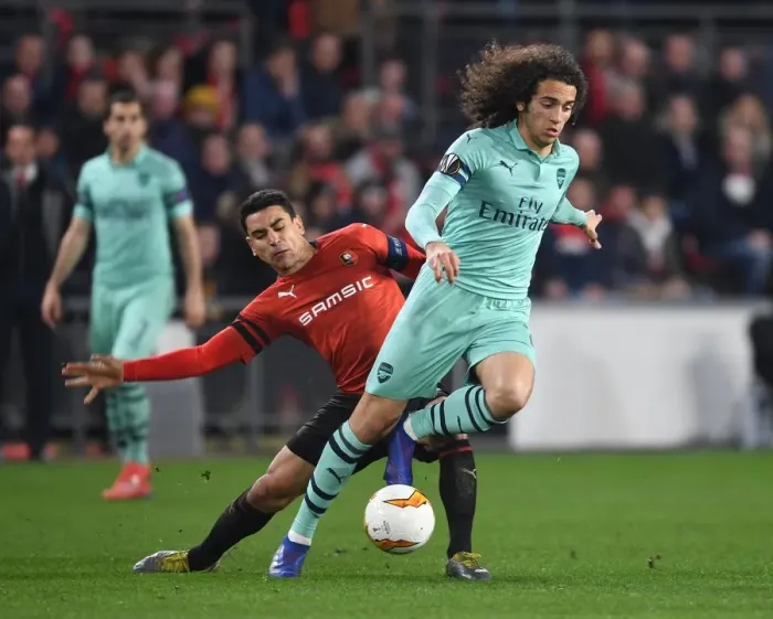 Framed Print : Guendouzi vs. Andre: A Fiery Europa League Clash between Arsenal and Rennes
