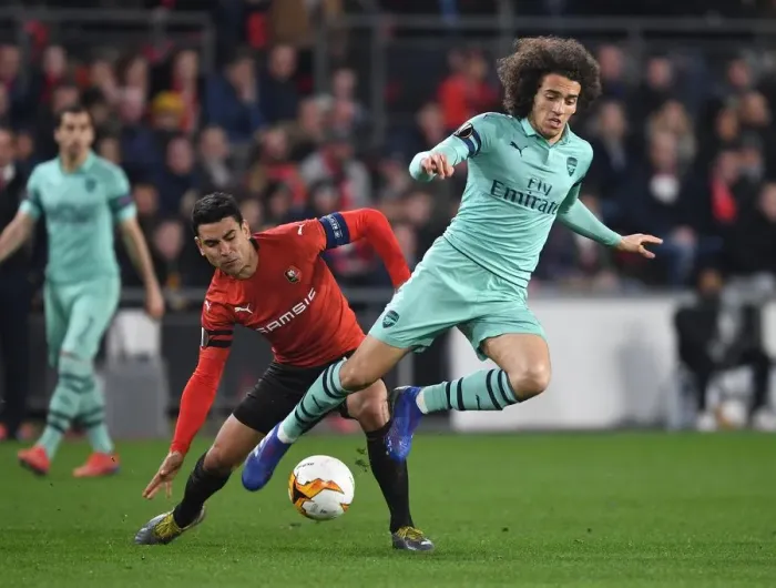 Framed Print : Guendouzi vs. Andre: Intense Clash in Arsenal's Europa League Battle with Rennes Framed Print : Guendouzi vs. Andre: Intense Clash in Arsenal's Europa League Battle with Rennes