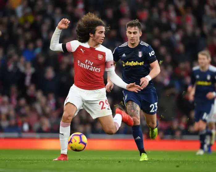 Framed Print : Guendouzi vs. Bryan: Intense Clash in Arsenal's Premier League Battle against Fulham (January 2019)