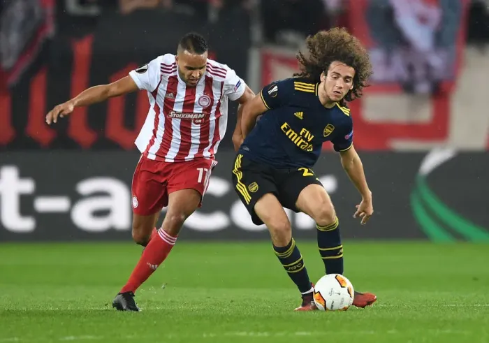 Framed Print : Guendouzi vs. Christodoulopoulos: Olympiacos vs. Arsenal, UEFA Europa League 2019-20: Intense Clash in Piraeus Framed Print : Guendouzi vs. Christodoulopoulos: Olympiacos vs. Arsenal, UEFA Europa League 2019-20: Intense Clash in Piraeus