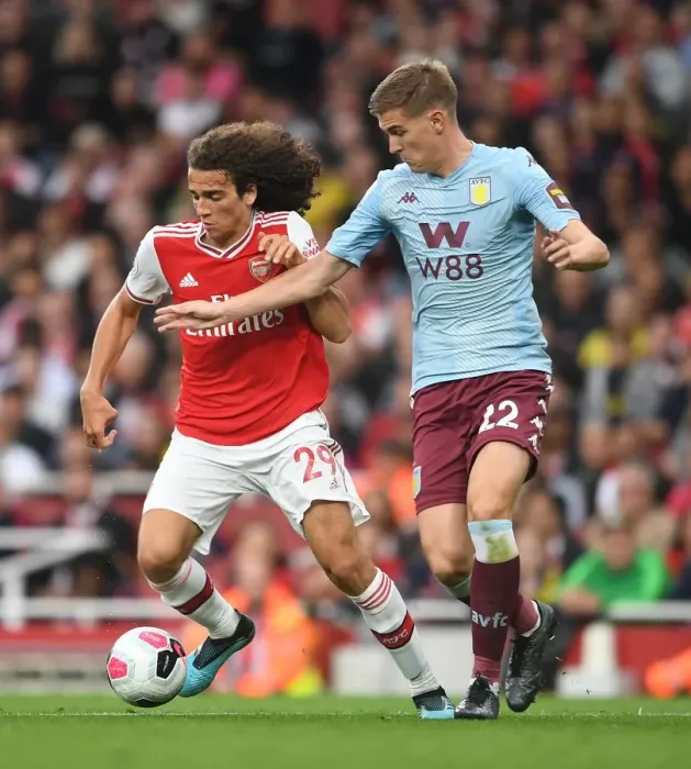 Framed Print : Guendouzi vs Engels: A Premier League Battle at Emirates Stadium