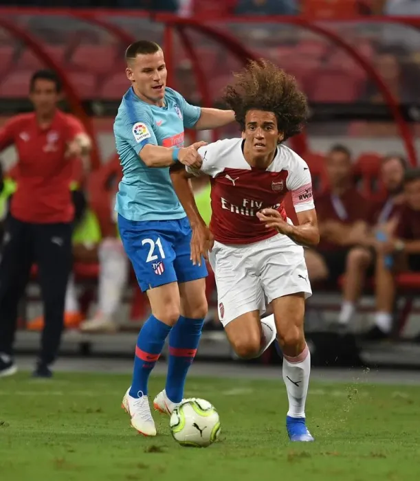 Framed Print : Guendouzi vs. Gameiro: Clash between Arsenal's Young Star and Atletico Madrid's Striker in 2018 International Champions Cup