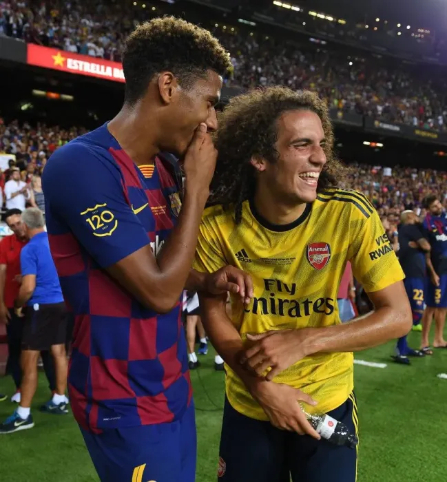 Framed Print : Guendouzi vs. Todibo: A Clash of Titans in FC Barcelona vs. Arsenal Pre-Season Face-Off Framed Print : Guendouzi vs. Todibo: A Clash of Titans in FC Barcelona vs. Arsenal Pre-Season Face-Off