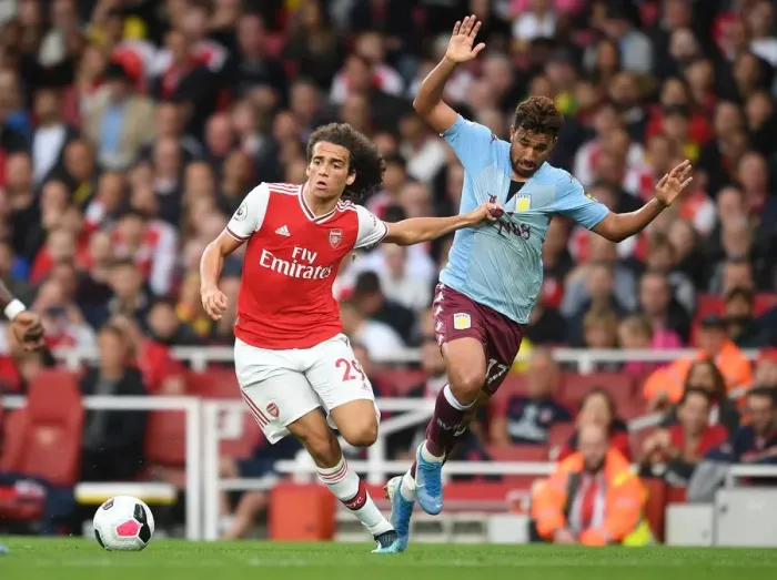 Framed Print : Guendouzi vs Trezeguet: Intense Clash Between Arsenal's Young Gun and Aston Villa Star (2019-20 Premier League)