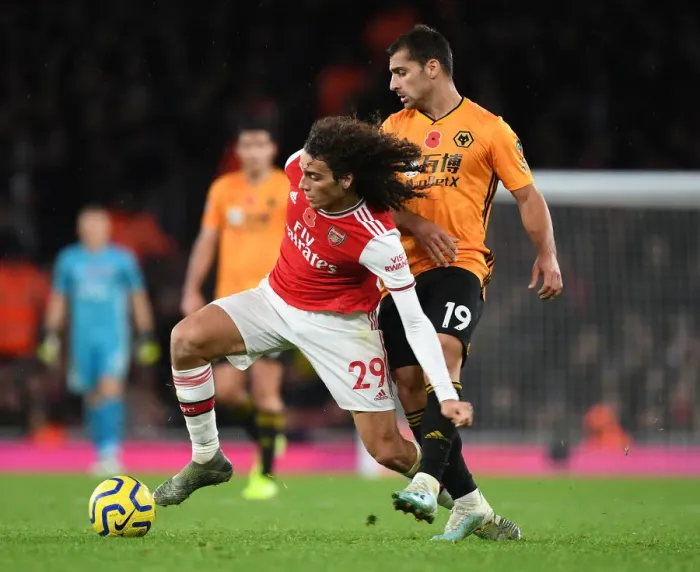 Framed Print : Guendouzi's Slick Moves: Arsenal's Midfield Mastery over Wolves Framed Print : Guendouzi's Slick Moves: Arsenal's Midfield Mastery over Wolves