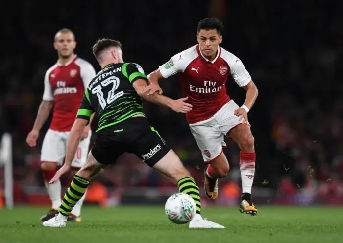 Framed Print : Head-to-Head: Alexis Sanchez vs. Ben Whiteman in the Carabao Cup Clash at Arsenal's Emirates Stadium Framed Print : Head-to-Head: Alexis Sanchez vs. Ben Whiteman in the Carabao Cup Clash at Arsenal's Emirates Stadium