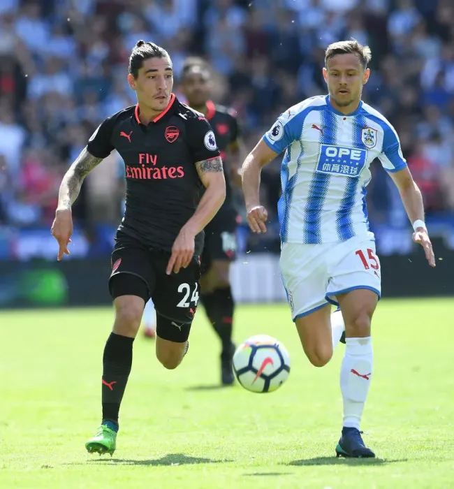 Framed Print : Hector Bellerin vs. Chris Lowe: Intense Battle in Huddersfield Town vs. Arsenal Premier League Clash