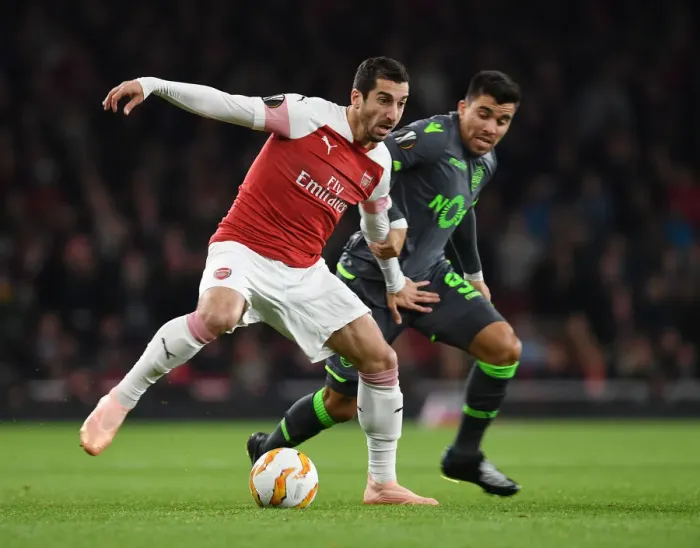 Framed Print : Henrikh Mkhitaryan Faces Off Against Marcos Acuna in Arsenal vs. Sporting CP UEFA Europa League Clash