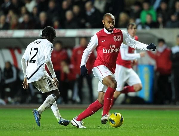 Henry vs. Dyer: Intense Battle at Swansea's Liberty Stadium (Arsenal vs. Swansea City, Premier League, 2011-12)