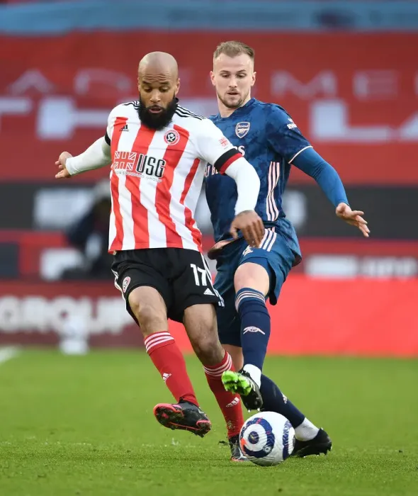 Framed Print : Holding Down Sheffield United: Arsenal's Rob Holding in Action Against David McGoldrick (April 2021) Framed Print : Holding Down Sheffield United: Arsenal's Rob Holding in Action Against David McGoldrick (April 2021)