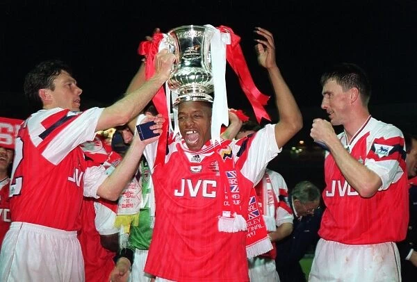 Ian Wright with the FA Cup flanked by David O'Leary and Andy Linighan