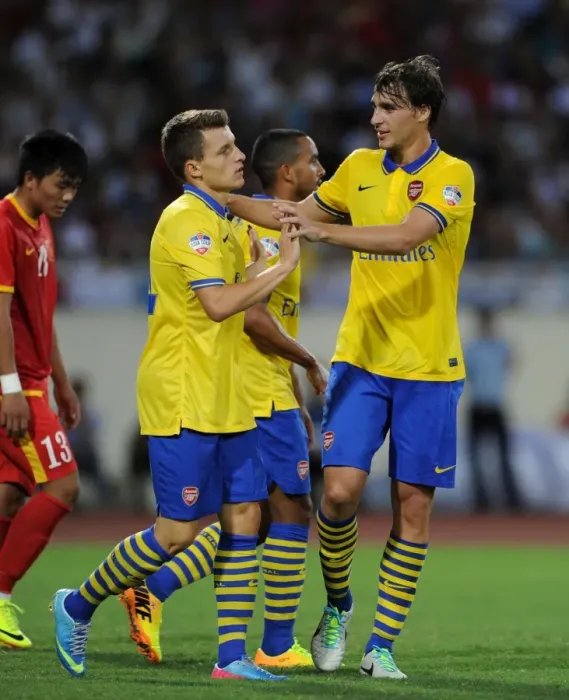 Framed Print : Ignasi Miquel and Thomas Eisfeld Celebrate Goal for Arsenal against Vietnam (2013)