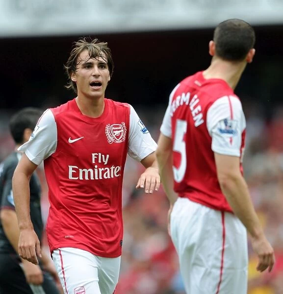 Ignasi Miquel and Thomas Vermaelen (Arsenal). Arsenal 0:2 Liverpool. Barclays Premier League