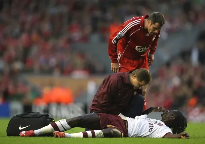 Framed Print : Injured Emmanuel Adebayor is treated by Arsenal physio Gary Lewin Framed Print : Injured Emmanuel Adebayor is treated by Arsenal physio Gary Lewin