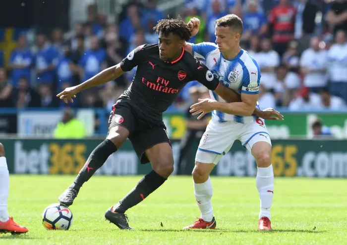 Framed Print : Intense Battle: Alex Iwobi vs. Jonathan Hogg in Premier League Showdown Framed Print : Intense Battle: Alex Iwobi vs. Jonathan Hogg in Premier League Showdown