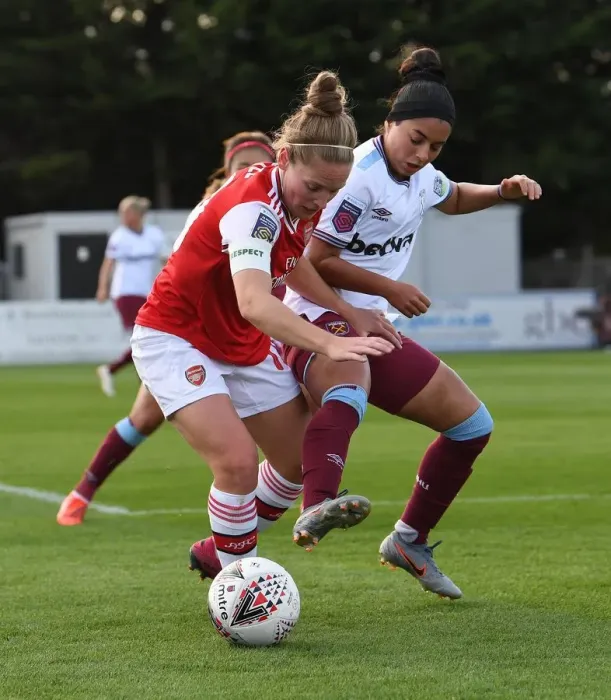Framed Print : Intense Battle: Arsenal Women vs West Ham United at Meadow Park