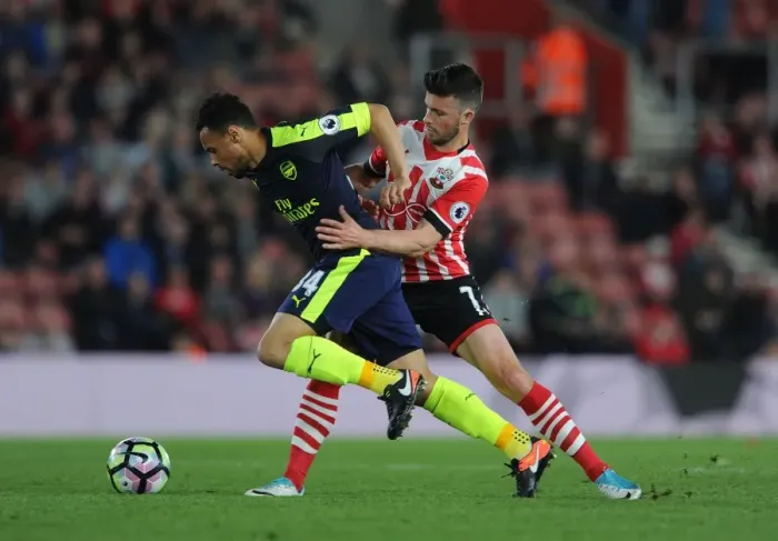Framed Print : Intense Battle: Coquelin vs Long - Premier League Showdown