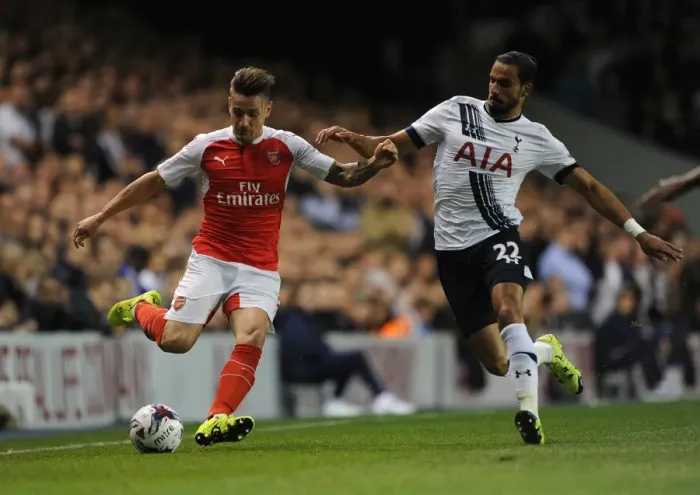 Framed Print : Intense Battle: Debuchy vs Chadli in the Capital One Cup Clash between Tottenham and Arsenal