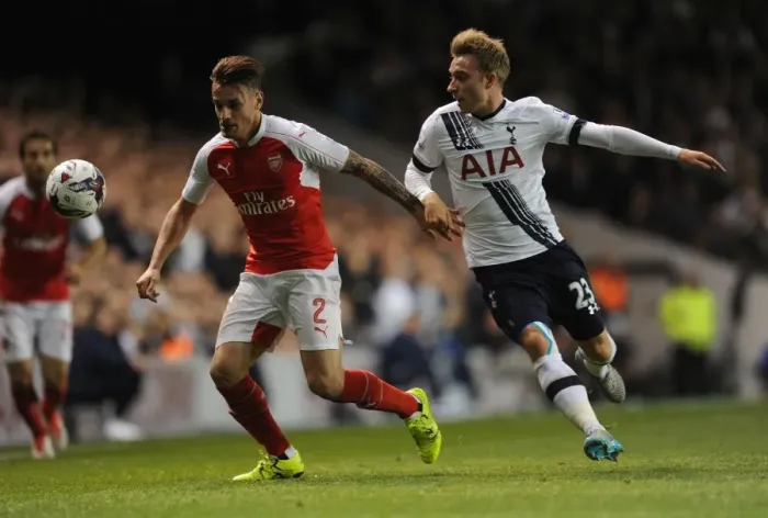Framed Print : Intense Battle: Debuchy vs. Eriksen in the Capital One Cup Clash Between Tottenham and Arsenal Framed Print : Intense Battle: Debuchy vs. Eriksen in the Capital One Cup Clash Between Tottenham and Arsenal