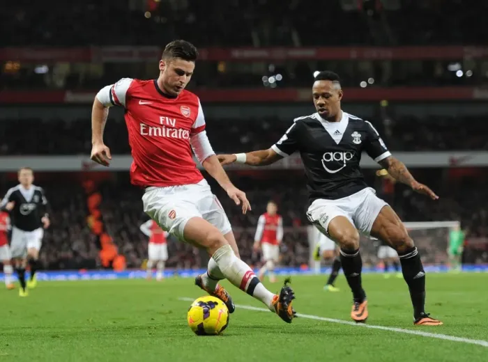 Framed Print : Intense Battle: Giroud vs Clyne - Arsenal vs Southampton, Premier League 2013-14